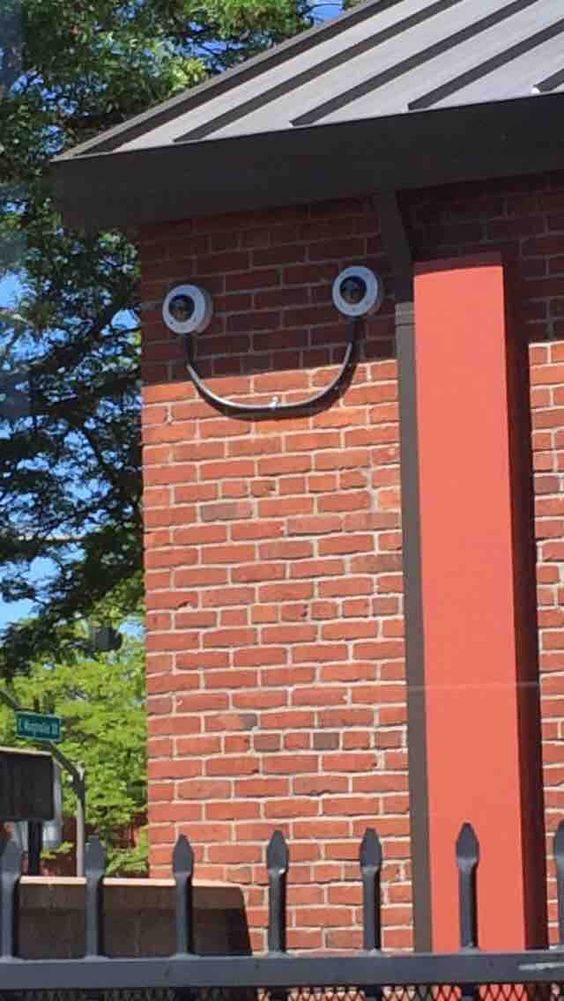 Smiling faces of outdoor surveillance camera